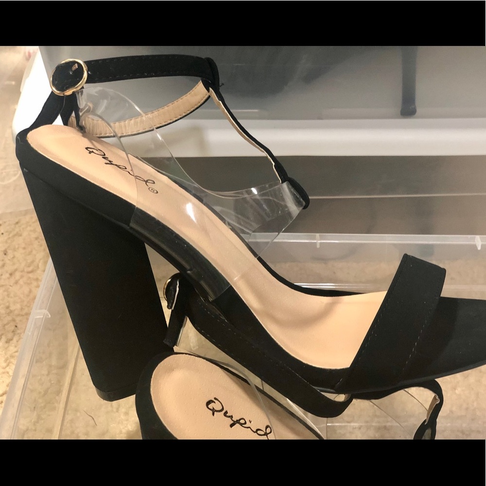 Black sandal with platform heels.